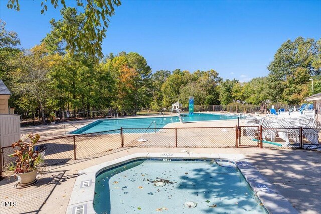 4201 Pin Oak Dr, Durham, NC 27707 - community pool featuring view of wooded area