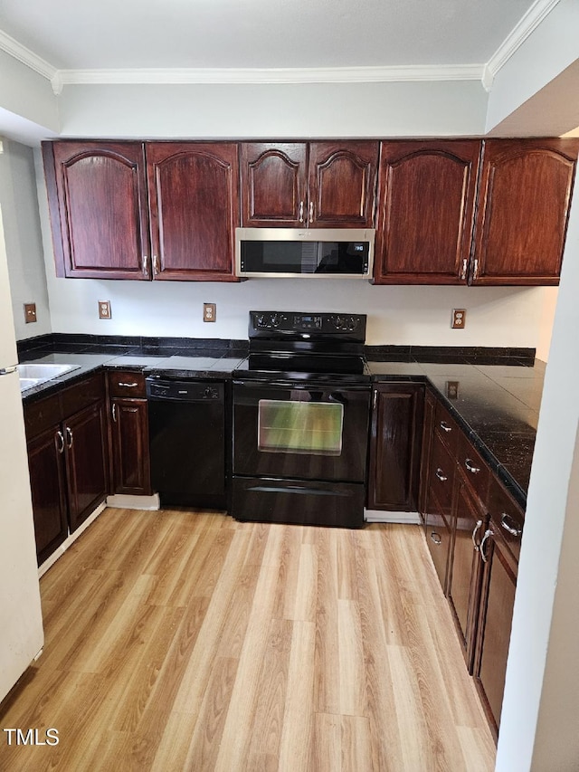 7030 Longstreet Dr Unit A, Raleigh, NC 27615 - kitchen with black appliances, light wood-type flooring, crown molding, dark stone counters, and dark brown cabinetry