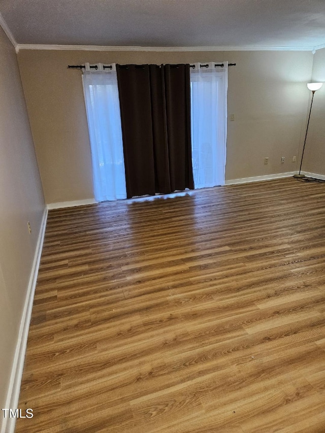 7030 Longstreet Dr Unit A, Raleigh, NC 27615 - empty room with ornamental molding and wood finished floors