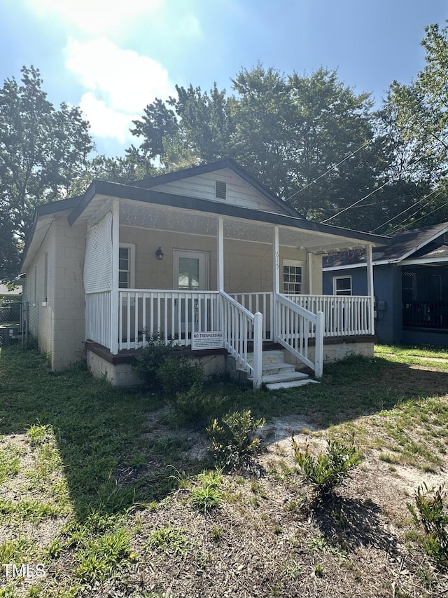 615 Manchester St SE, Wilson, NC 27893 - bungalow-style house featuring a porch and concrete block siding