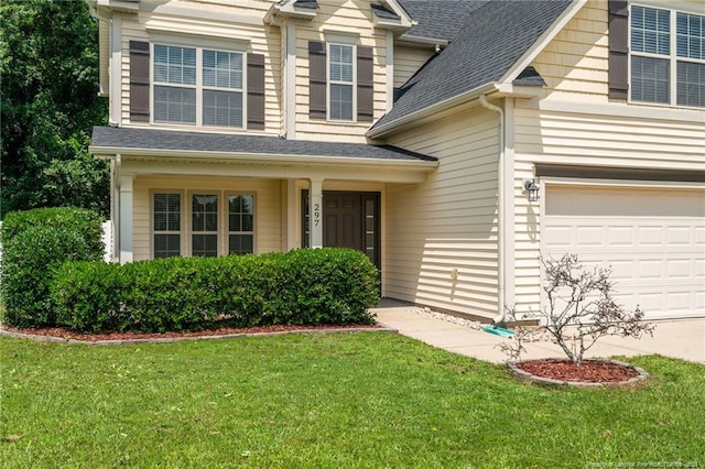 297 Colonist Pl, Cameron, NC 28326 - view of front of home featuring a front lawn, a shingled roof, and a garage