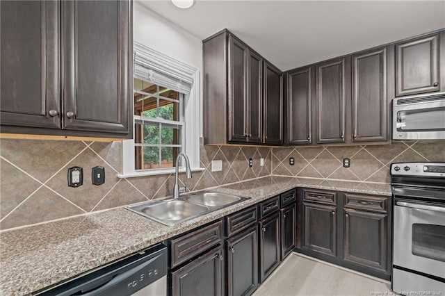297 Colonist Pl, Cameron, NC 28326 - kitchen with appliances with stainless steel finishes, decorative backsplash, and dark brown cabinetry