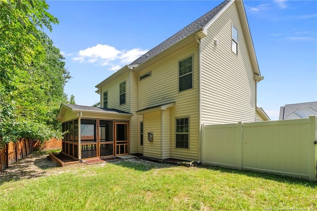 297 Colonist Pl, Cameron, NC 28326 - rear view of house with a sunroom and a fenced backyard