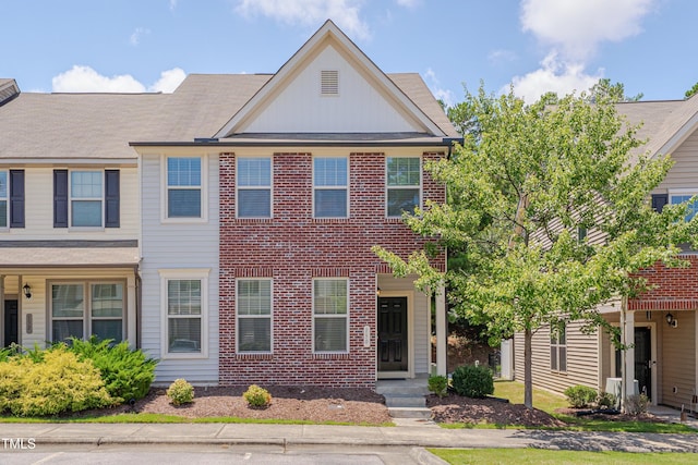 130 Holly Berry Ln, Durham, NC 27703 - view of front of house with board and batten siding and brick siding