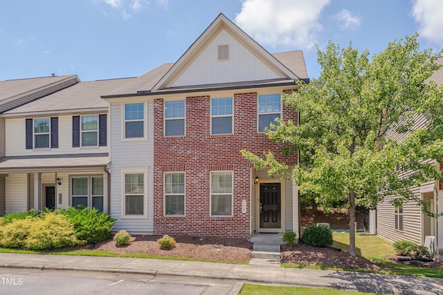 130 Holly Berry Ln, Durham, NC 27703 - view of front of house with brick siding and board and batten siding