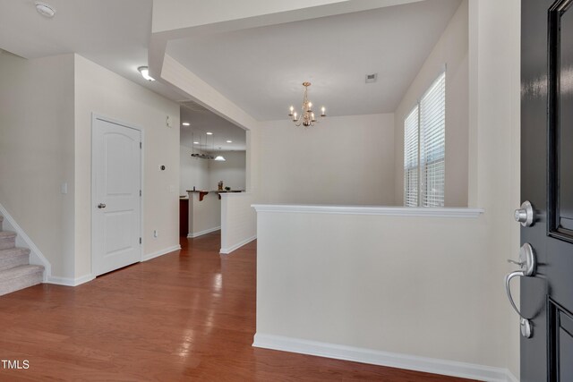 130 Holly Berry Ln, Durham, NC 27703 - foyer with a chandelier, wood finished floors, and stairway