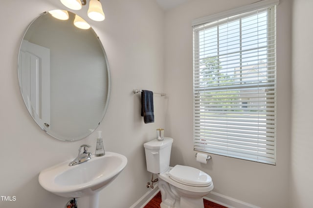130 Holly Berry Ln, Durham, NC 27703 - bathroom featuring baseboards and wood finished floors