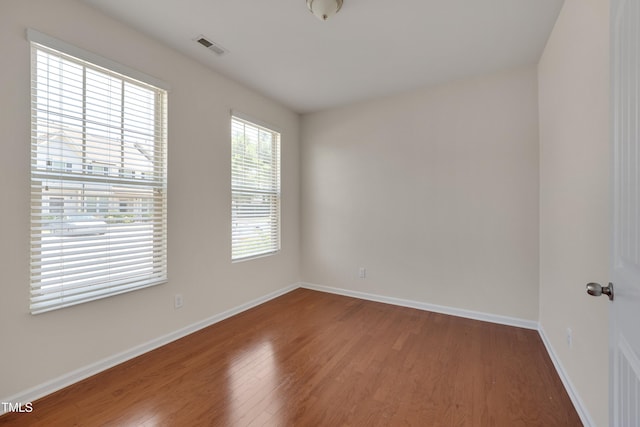 130 Holly Berry Ln, Durham, NC 27703 - unfurnished room featuring wood finished floors and baseboards
