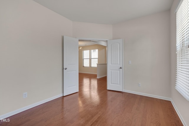 130 Holly Berry Ln, Durham, NC 27703 - unfurnished room with wood finished floors and baseboards