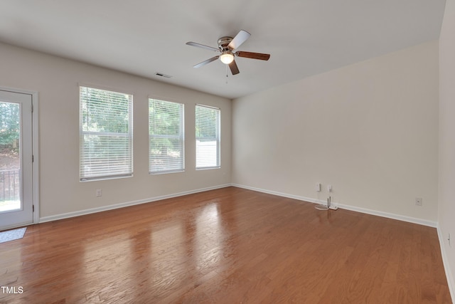 130 Holly Berry Ln, Durham, NC 27703 - spare room with ceiling fan, healthy amount of natural light, and wood finished floors