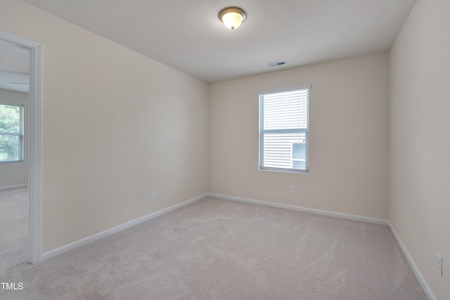 130 Holly Berry Ln, Durham, NC 27703 - empty room with light carpet and baseboards