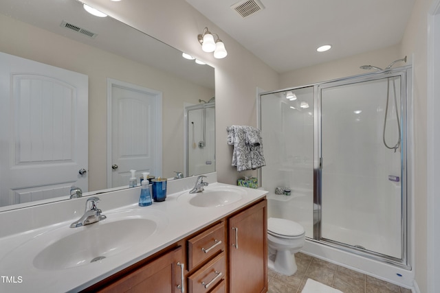 130 Holly Berry Ln, Durham, NC 27703 - bathroom with double vanity, a shower stall, and tile patterned flooring