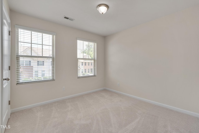 130 Holly Berry Ln, Durham, NC 27703 - empty room featuring light carpet and baseboards