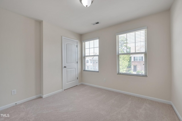 130 Holly Berry Ln, Durham, NC 27703 - unfurnished room with light colored carpet