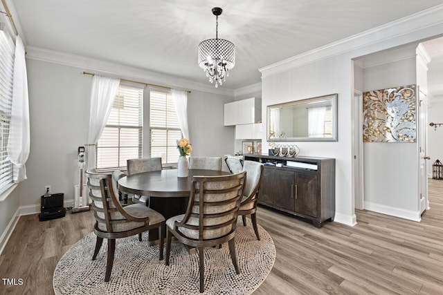 27 Needham Ln, Clayton, NC 27527 - dining space featuring ornamental molding, a chandelier, and light wood-style flooring