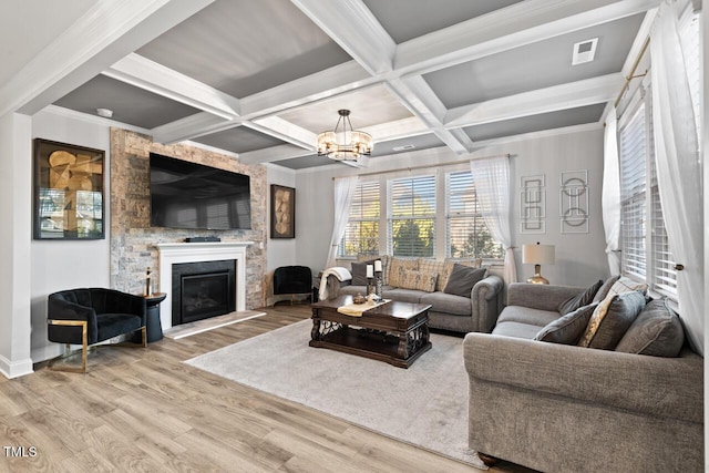27 Needham Ln, Clayton, NC 27527 - living area with wood finished floors, beamed ceiling, a chandelier, a fireplace, and coffered ceiling
