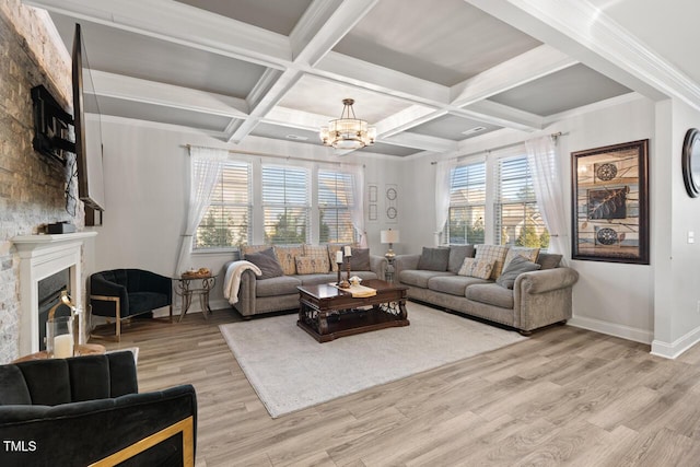 27 Needham Ln, Clayton, NC 27527 - living area with a fireplace, a chandelier, light wood-style flooring, beam ceiling, and coffered ceiling