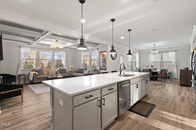 27 Needham Ln, Clayton, NC 27527 - kitchen featuring stainless steel dishwasher, a chandelier, crown molding, light wood finished floors, and a center island with sink