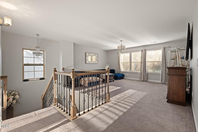 27 Needham Ln, Clayton, NC 27527 - stairway with a chandelier and carpet flooring