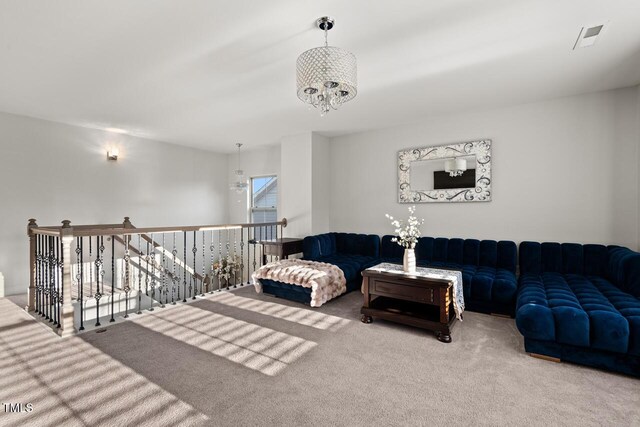 27 Needham Ln, Clayton, NC 27527 - living room featuring carpet flooring and a chandelier