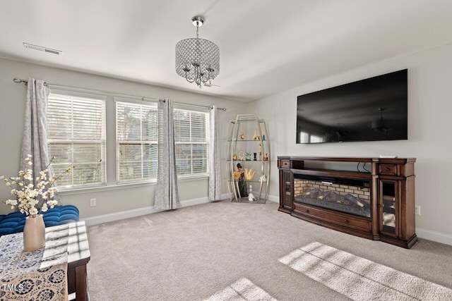 27 Needham Ln, Clayton, NC 27527 - carpeted living room with a chandelier and baseboards