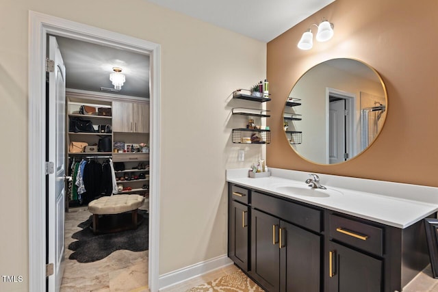 27 Needham Ln, Clayton, NC 27527 - bathroom featuring vanity and a walk in closet