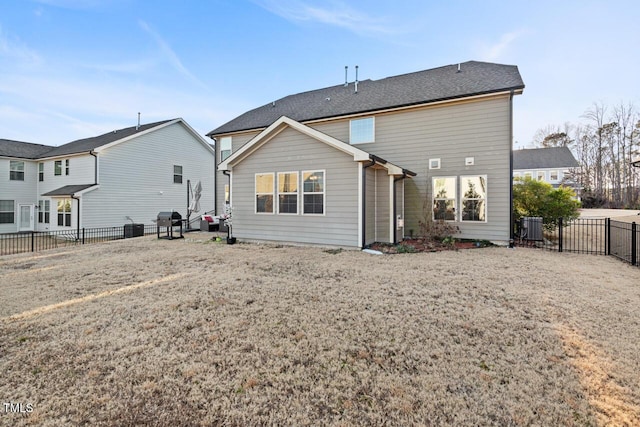27 Needham Ln, Clayton, NC 27527 - rear view of house with a fenced backyard