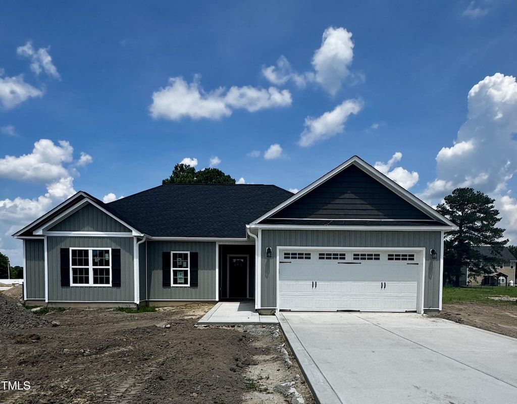 100 Nova Pl, Pikeville, NC 27863 - view of front of house with driveway and a garage