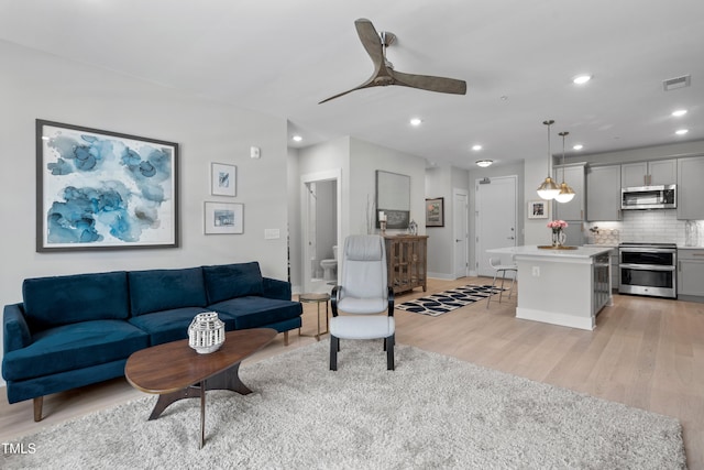 105 Chatham Walk Ln Unit 208, Cary, NC 27511 - living room with light wood-style flooring, a ceiling fan, and recessed lighting