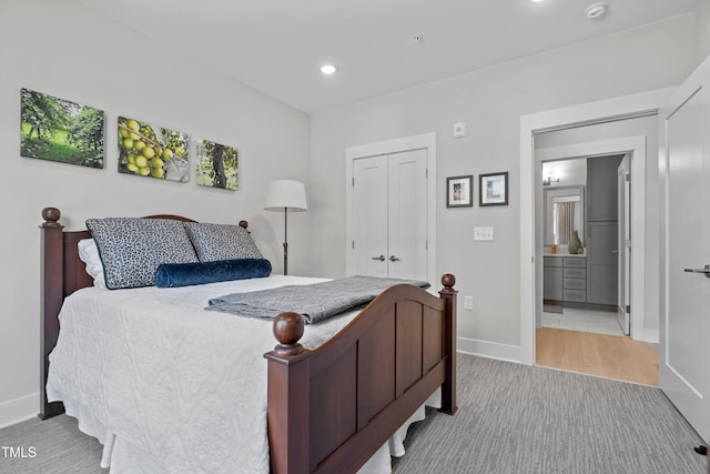 105 Chatham Walk Ln Unit 208, Cary, NC 27511 - bedroom with a closet, recessed lighting, light colored carpet, and connected bathroom