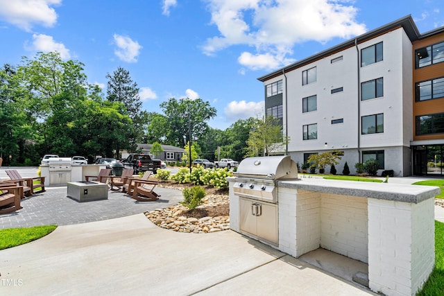 105 Chatham Walk Ln Unit 208, Cary, NC 27511 - view of patio featuring area for grilling and a fire pit