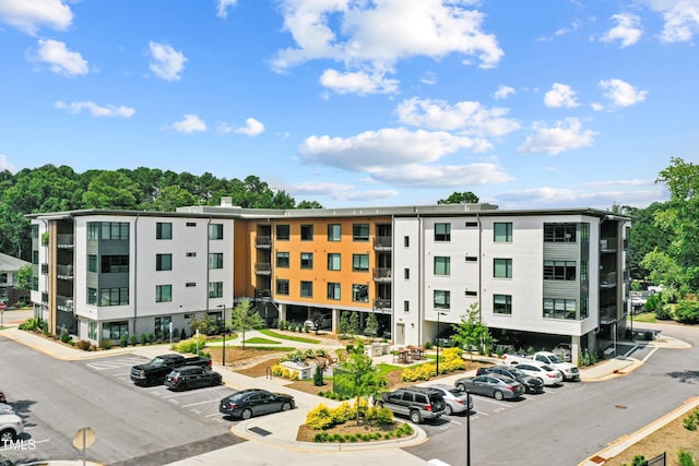 105 Chatham Walk Ln Unit 208, Cary, NC 27511 - view of apartment building / complex featuring uncovered parking
