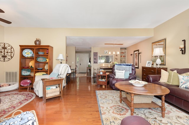 7 Weybridge Pl, Chapel Hill, NC 27517 - living room with ceiling fan and light wood-style flooring