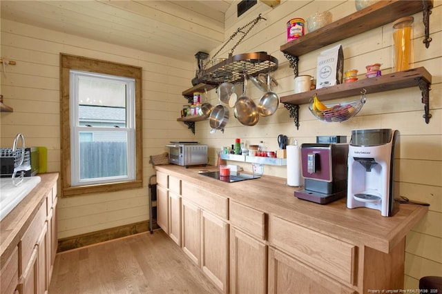 1203 Simpson St, Fayetteville, NC 28305 - kitchen featuring wooden counters, light wood-type flooring, wooden walls, and open shelves