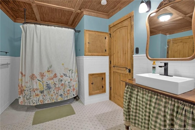 1203 Simpson St, Fayetteville, NC 28305 - bathroom with wood ceiling, vanity, wainscoting, and a shower with curtain