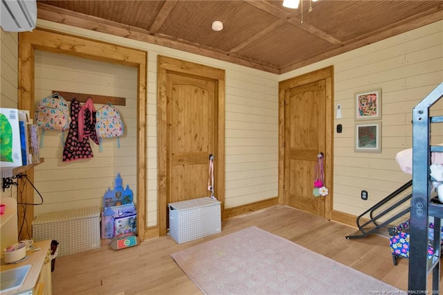 1203 Simpson St, Fayetteville, NC 28305 - interior space featuring wooden walls, wood finished floors, a wall unit AC, and wooden ceiling