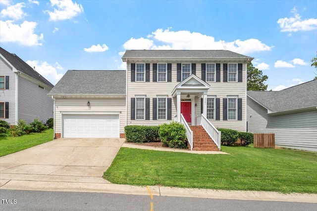 2301 Laurel Valley Way, Raleigh, NC 27604 - colonial inspired home with an attached garage, driveway, a front lawn, and a shingled roof