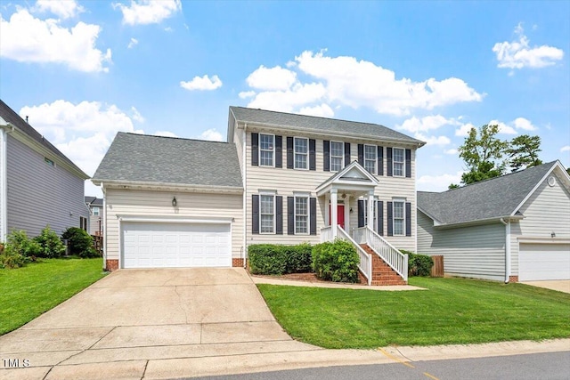 2301 Laurel Valley Way, Raleigh, NC 27604 - colonial house with a front yard, concrete driveway, an attached garage, and a shingled roof