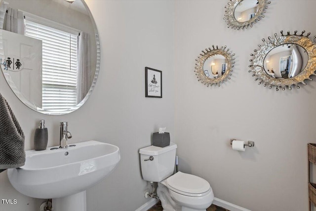 2301 Laurel Valley Way, Raleigh, NC 27604 - bathroom featuring baseboards and toilet