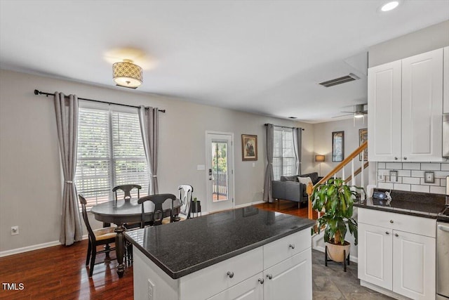 2301 Laurel Valley Way, Raleigh, NC 27604 - kitchen featuring dark countertops, tasteful backsplash, a ceiling fan, white cabinetry, and recessed lighting