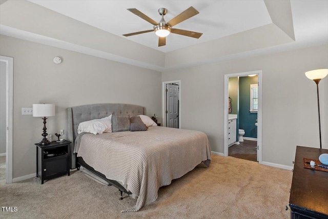 2301 Laurel Valley Way, Raleigh, NC 27604 - bedroom featuring carpet floors, a tray ceiling, ensuite bathroom, and ceiling fan