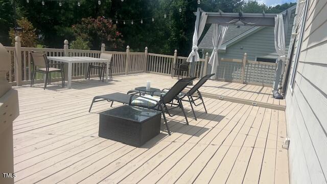 2301 Laurel Valley Way, Raleigh, NC 27604 - wooden deck featuring outdoor dining area