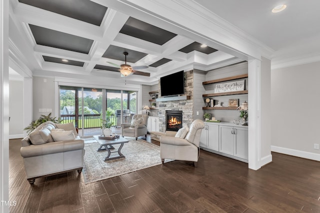 3329 Donlin Dr, Wake Forest, NC 27587 - living room with a stone fireplace, ceiling fan, crown molding, dark wood-type flooring, and beam ceiling