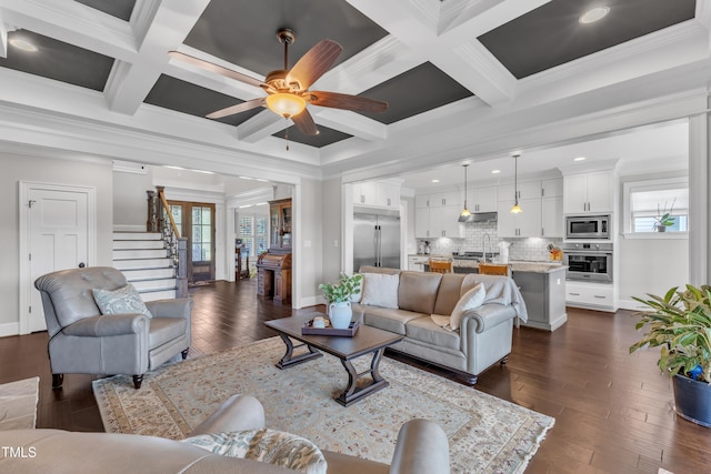 3329 Donlin Dr, Wake Forest, NC 27587 - living room with healthy amount of natural light, ornamental molding, ceiling fan, stairway, and dark wood-type flooring