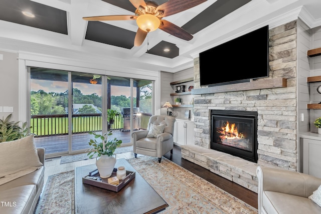 3329 Donlin Dr, Wake Forest, NC 27587 - living area featuring wood finished floors, coffered ceiling, ceiling fan, a stone fireplace, and crown molding