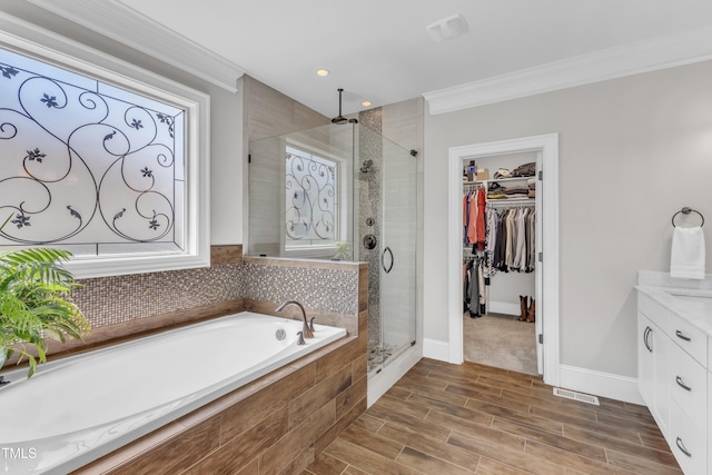 3329 Donlin Dr, Wake Forest, NC 27587 - full bath featuring crown molding, a stall shower, vanity, a bath, and a spacious closet