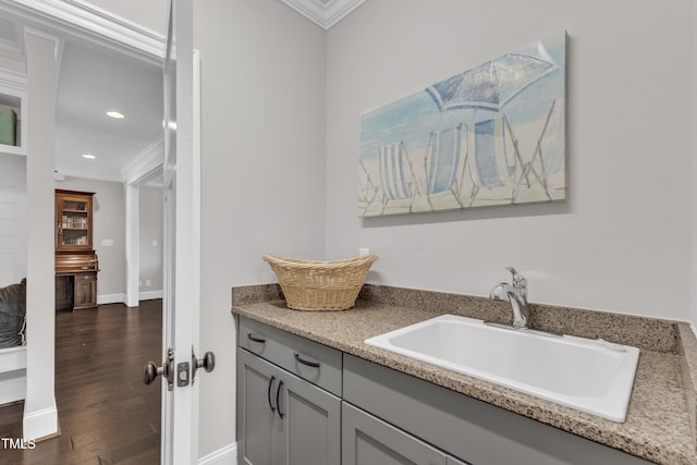 3329 Donlin Dr, Wake Forest, NC 27587 - bar area featuring crown molding, dark wood finished floors, and recessed lighting