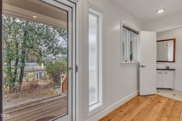 206 Spring Ln, Chapel Hill, NC 27514 - entryway featuring light wood-style floors and baseboards