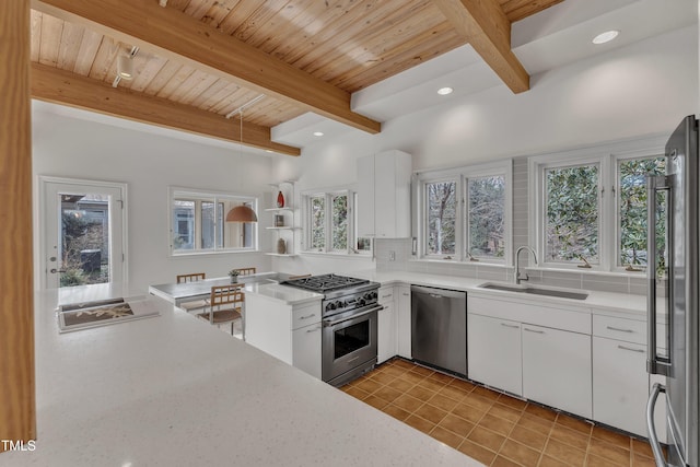 206 Spring Ln, Chapel Hill, NC 27514 - kitchen featuring stainless steel appliances, light tile patterned floors, light countertops, white cabinetry, and a wooden ceiling with exposed beams
