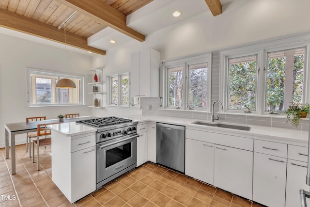 206 Spring Ln, Chapel Hill, NC 27514 - kitchen featuring light tile patterned floors, stainless steel appliances, a wooden ceiling with exposed beams, light countertops, and a peninsula